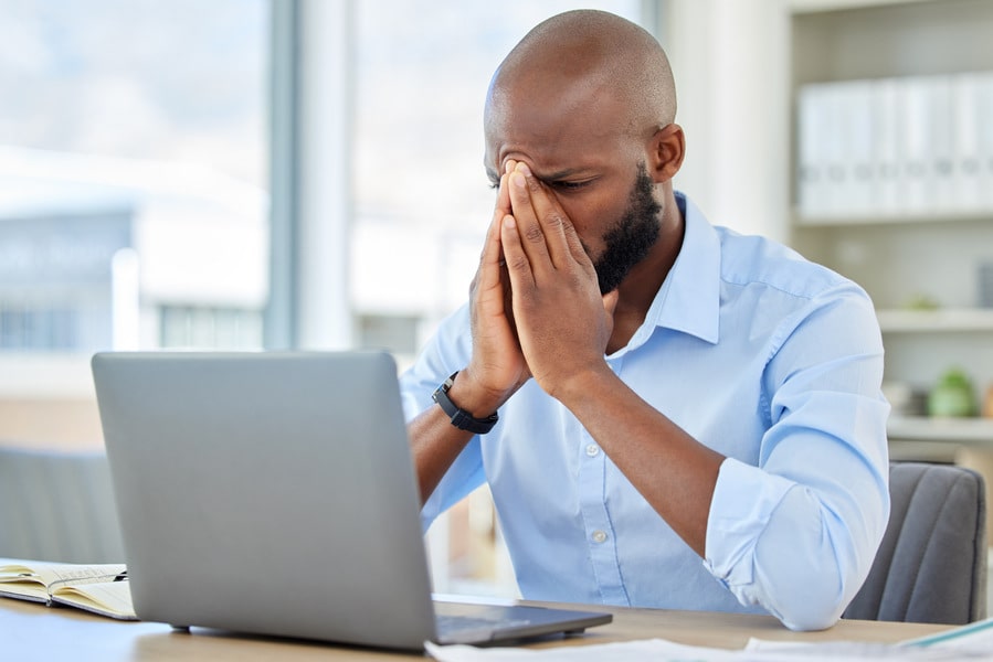 stress-anxiety-and-tired-businessman-with-a-lapto-2023-11-27-04-56-07-utc-min.jpg